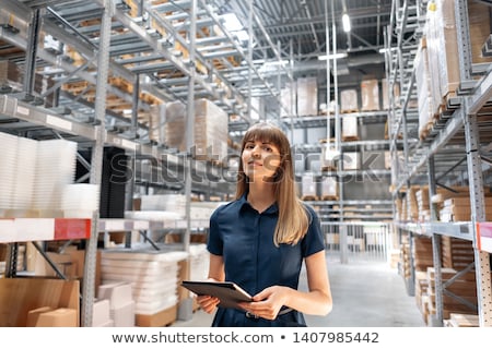 Stock fotó: Pretty Warehouse Manager Checking The Inventory