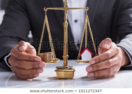 Stock foto: Businessperson Protecting Stack Of Coins