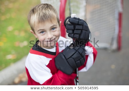 Portrait Of Happy Child Play Hockey Outside Foto d'archivio © Lopolo