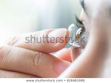 Stok fotoğraf: Woman Putting In Her Contact Lenses