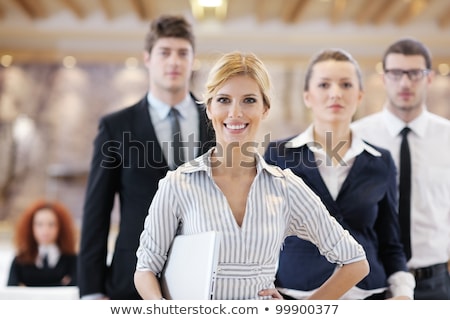 Business Woman Standing With Her Staff At Conference [[stock_photo]] © dotshock