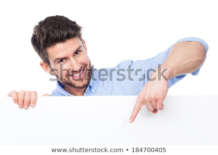 Stock fotó: Man Pointing At White Blank Poster