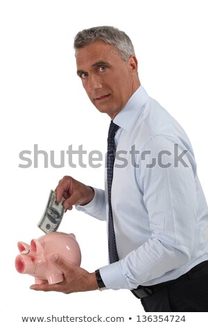 Foto stock: Handsome Mature Banker And Piggy Bank