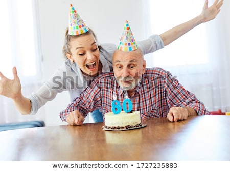 Foto stock: Man Blows Out His Birthday Candles