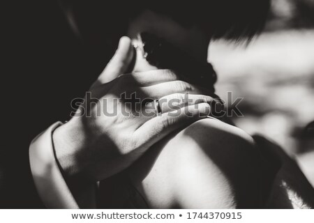 Stok fotoğraf: Bride Wearing Wedding Ring With Hand On Grooms Shoulder