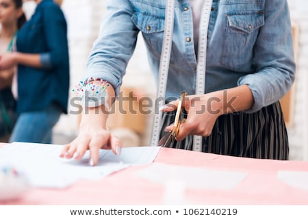 Сток-фото: Fashion Designer With Cloth Making Dress At Studio