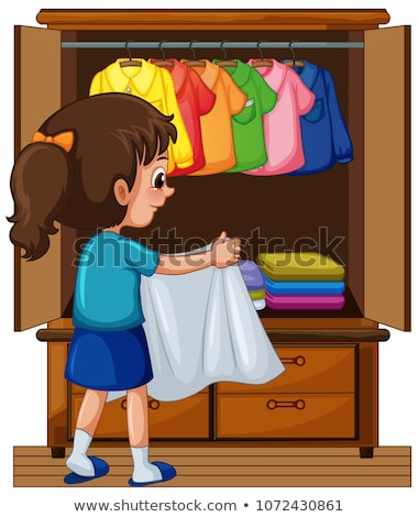 Stockfoto: Girl Putting Away Clothes In Closet