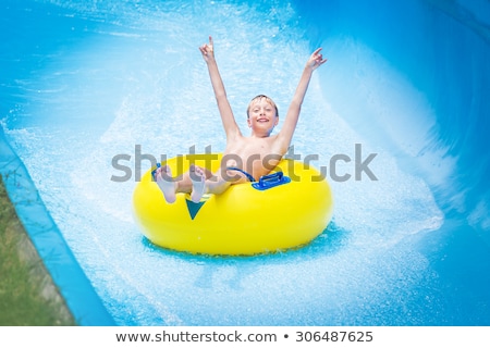 ストックフォト: Children Enjoying In Pool Water Slide At Pool