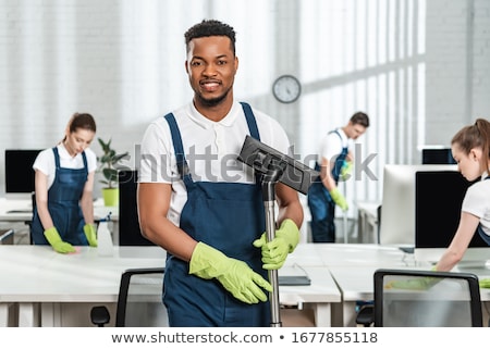 Stock foto: Team Of Commercial Cleaners Working In An Office