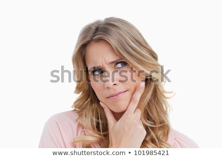 Stock photo: Serious Blonde Woman Placing Her Hand On Her Chin Against A White Background