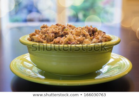 Foto d'archivio: Turkey Stuffing In Green Bowl With Bokeh Background