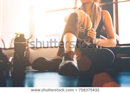 Сток-фото: Woman Sitting On Window With An Apple