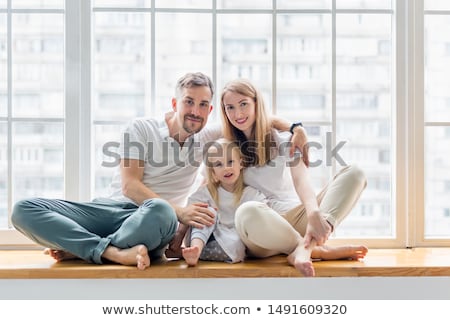Zdjęcia stock: Family Sitting On Windowsill Portrait