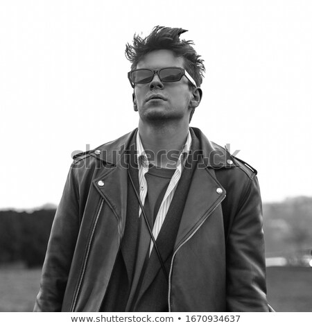 Outdoor Photo Of Handsome Stylish Guy In Leather Jacket Looking Stok fotoğraf © Alones