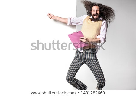 Stockfoto: Jumping Nerd Pointing An Empty Board