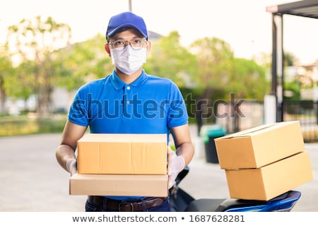 Stock photo: Delivery Of Goods With Medical Mask