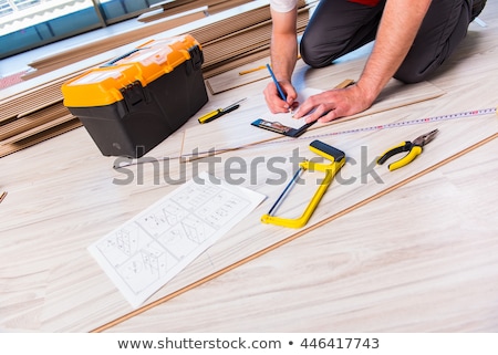 Man Laying Laminate Floor In Apartment Stock foto © Elnur