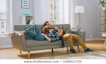 Stock photo: Couple Lying On A Couch Together