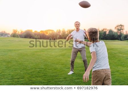 Stockfoto: Little Kid While Throwing The Ball