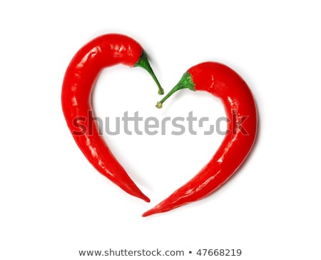 ストックフォト: Two Chili Peppers Forming A Shape Of Heart Hot Lover Symbol