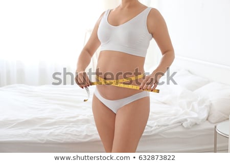 Stock foto: Pregnant Woman Measuring Her Abdomen