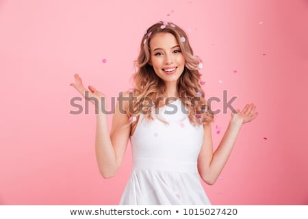 Stok fotoğraf: Young Woman In Pink Dress Isolated On White