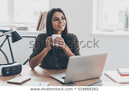 Zdjęcia stock: Beautiful Woman Wearing Virtual Reality Device While Holding Joysticks