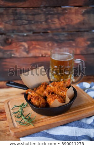 Foto stock: A Plate Of Fresh Hot Crispy Fried Chicken With Red Sause On A