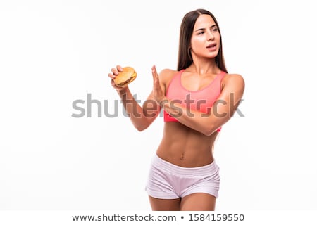 Foto d'archivio: Image Of Serious Chubby Woman In Tracksuit Doing Stop Gesture Wh