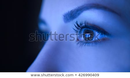 Foto stock: Close Up Of Woman Eye Looking At Computer Screen