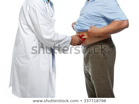 Stock foto: Human Hand Measuring Stomach Fat With Caliper