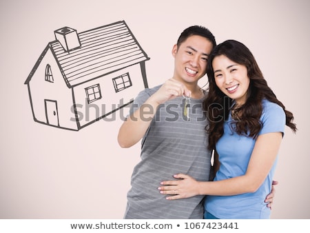 Stockfoto: Couple Holding Key With House Drawing In Front Of Vignette