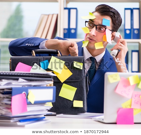 Foto stock: Businessman With Reminder Notes In Multitasking Concept