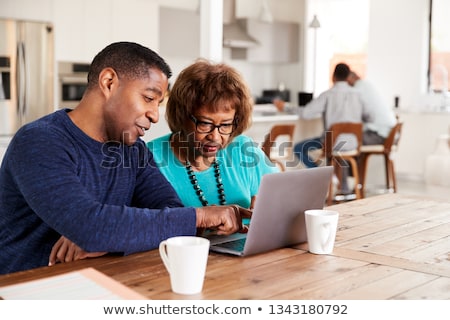 Stock fotó: Son Helping Mother On Laptop