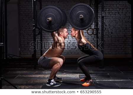 Foto d'archivio: Gym Group With Weight Lifting Bar Crossfit Workout