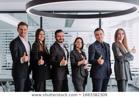 Stock photo: Smiling Asian Businesswoman Showing Thumbs Up