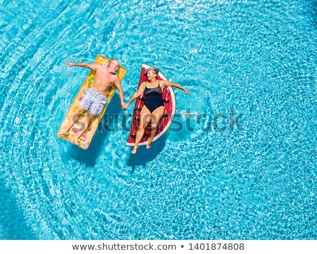 Foto stock: Couple Having Fun In Swimming Pool