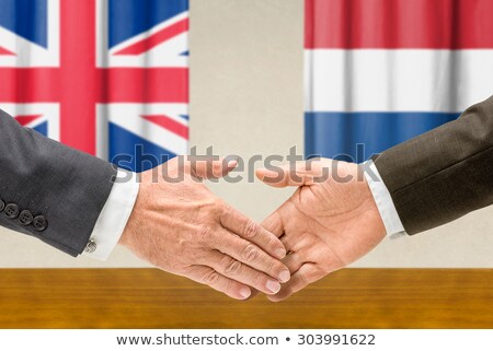 Stock photo: Representatives Of The Uk And The Netherlands Shake Hands