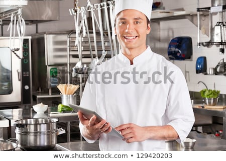 Stock fotó: Smiling Chef Cook Holding Tablet Computer