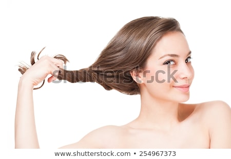 Foto stock: Portrait Of A Girl Pulling Hair And Looking At Camera