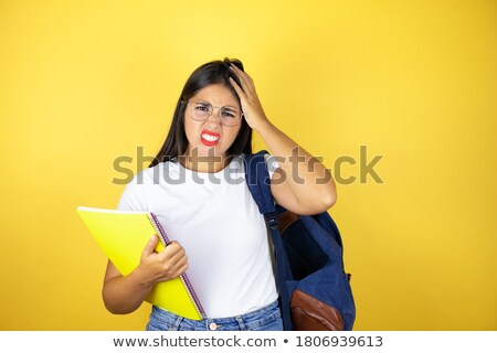 Foto stock: Desperate Teenage Girl In Glasses Holding To Head