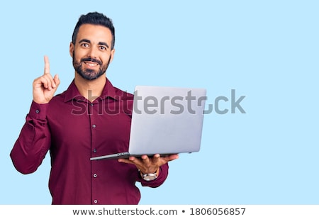 ストックフォト: Portrait Of A Young Man Holding One Finger Up