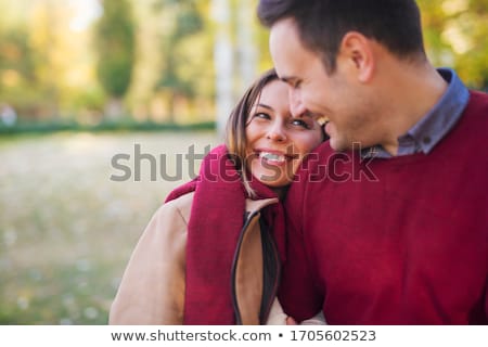 Foto stock: Smiling Couple Hugging In Autumn Park