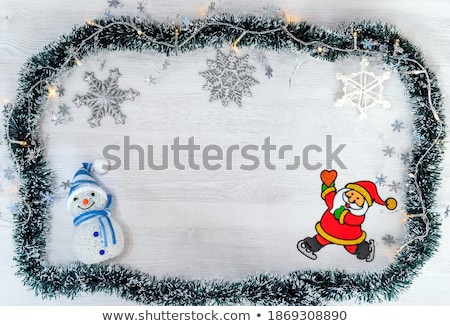 Stockfoto: Christmas Decoration Holiday With Santa Claus And Snowman On Sno