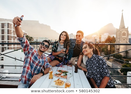 Stock photo: Happy Friends Taking Selfie At Rooftop Party