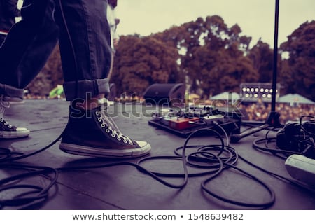 Zdjęcia stock: Rocker With Guitar And Foot