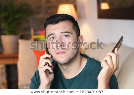 Foto stock: Man With Two Phones