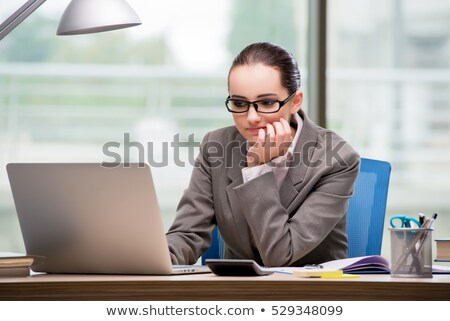 A Sad Businesswoman Sitting At Her Workplace Imagine de stoc © Elnur