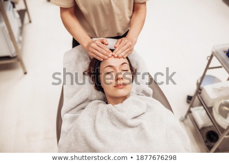 Zdjęcia stock: Young Woman With Eyes Closed Receiving A Massage