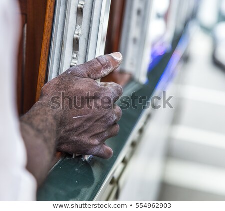 Foto stock: Black Mans Hand On A Railing Of A Streetcar In New Orleans